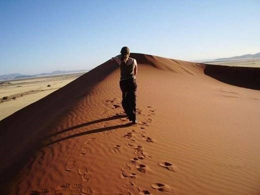 Climbing a dune in Namibia Climbing a dune in Namibia