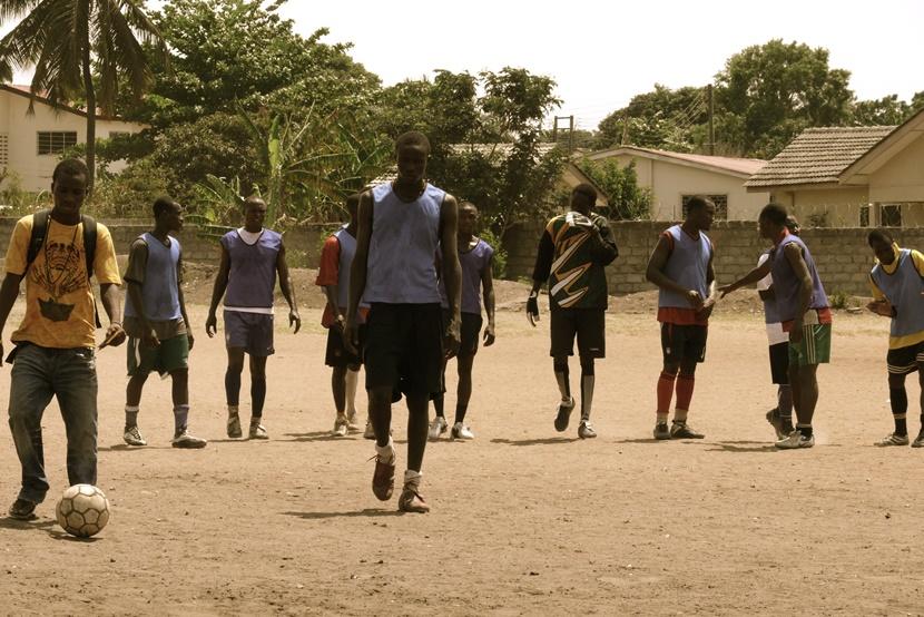A group of men at a football match Group of men on soccer pitch