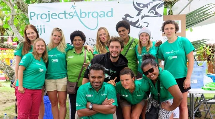 Group of volunteers and locals in the shark conservation project in Fiji, Australasia Group of volunteers and locals in the shark conservation project in Fiji, Australasia