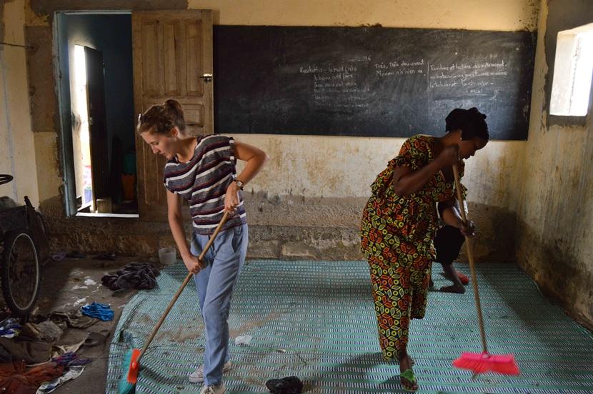 A volunteer works with the local project coordinator to help clean a daara A Belgian Projects Abroad volunteer works with local staff to help clean a daara where talibé children sleep in Saint Louis, Senegal