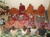 Volunteers and monks at ceremony