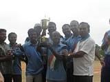 The winning team with the trophy