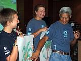 Volunteers and staff explaining mangroves