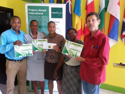The winners of Operation Get Ready show off their certificates. he winners of Projects Abroad Jamaica’s Operation Get Ready competition pose with their certificates.