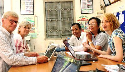 Helge and Kina discussing the development of the Micro-finance Project in Cambodia Volunteers discuss the potential to open a new micro-finance initiative with Khemara