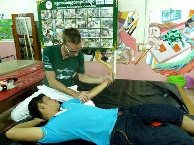 A volunteer works with a patient at our rehabilitation centre A local Cambodian is provided with physiotherapy