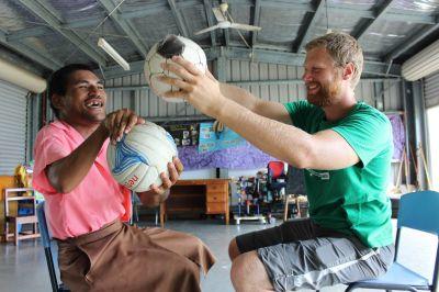 Volunteer at Physiotherapy Placement Projects Abroad volunteer works with a patient at his physiotherapy placement in Samoa