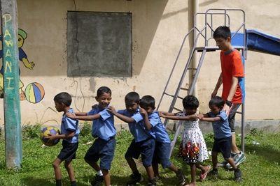 A volunteer at a Care project in Sri Lanka plays games with a group of children Projects Abroad Care volunteer, Herman Chi Hong Chan, plays games with children at his placement at Dutch Anne Preschool in Panadura.