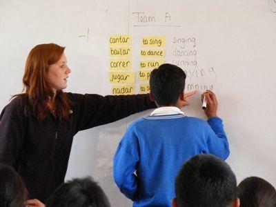 A volunteer teaches children English at her placement in Urubamba, Peru Projects Abroad volunteer teaches children English at school during a Teaching placement in Urubamba, Peru
