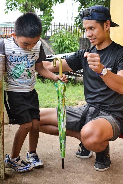 A volunteer administering physiotherapy to a young boy Projects Abroad Physiotherapy volunteer, Victor Lee, with a young boy who is one of his outpatients.