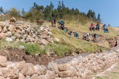 Archaeology volunteers work on excavations at their new dig site in Sacsayhuamn Volunteers on the archaeology project excavate a plot of land in Sacsayhuaman