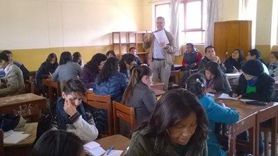 Volunteer teaching speaking to his class during the annual Teacher Training project in Peru Older volunteer teaching a class of local teachers