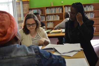 Maria Mulindi assists a new Human Rights volunteer at a legal clinic Working with a client in Cape Town, South Africa