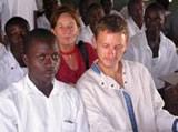 Mircea and volunteer visiting refugee camp school