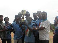 The winning team with the trophy