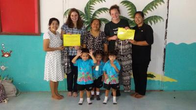 Care volunteers with the teachers and children at a day care centre Care volunteers with the teachers and children at a day care centre