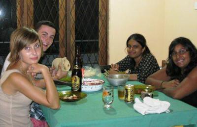 With my host family Enjoying a meal with volunteers