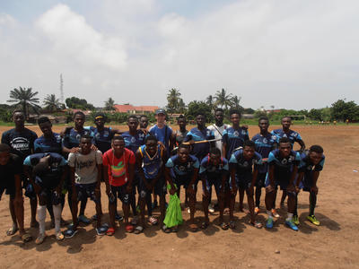 Julien with a local football team Julien with a local football team
