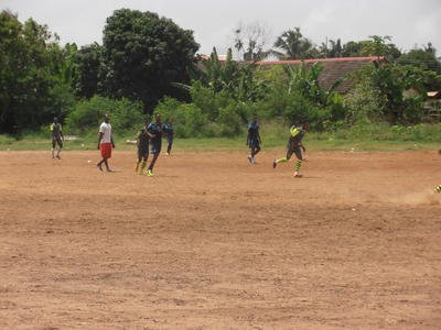 Local players during a football game in Ghana Local players during a football game in Ghana