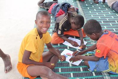 The children in Senegal busy with a classroom activity The children in Senegal busy with a classroom activity