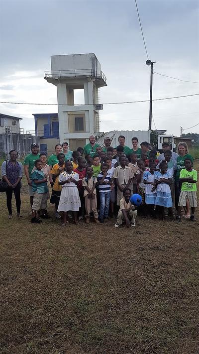 Conservation staff and school children before a beach clean-up in Sint Bight Belize Conservation staff and school children before a beach clean-up in Sint Bight Belize