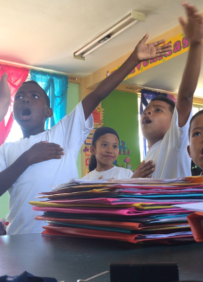 Students singing in the classroom Students singing in the classroom
