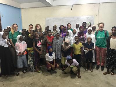 Volunteer and local children pose for a group photograph Volunteer and local children pose for a group photograph