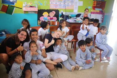 Volunteers and children at a local school in Ecuador Volunteers and children at a local school in Ecuador