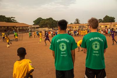 Football volunteers supervising a game Football volunteers supervising a game