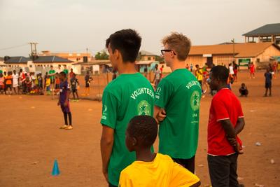 Volunteers watching a football game Volunteers watching a football game