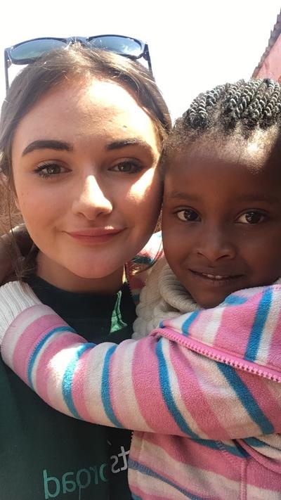 Kate spends time with a child in Kenyat Kate spends time with a child in Kenya