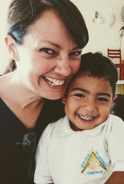 Kate with a child at her Care placement Kate with a child at her Care placement