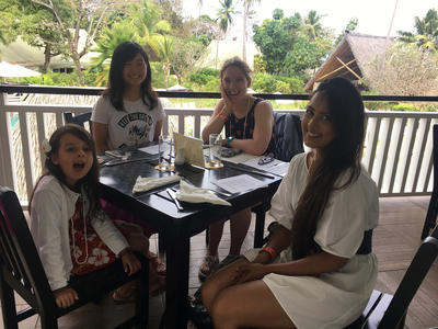 Care volunteers enjoy a meal together in Fiji Care volunteers enjoy a meal together in Fiji