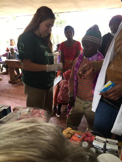 Volunteers assisting at a medical outreach in Tanzania Volunteers assisting at a medical outreach in Tanzania