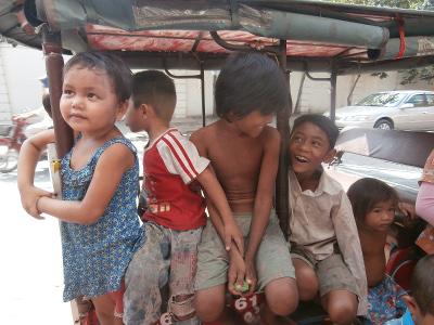 Local Children Sitting on a Tuk Tuk Local Children Sitting on a Tuk Tuk