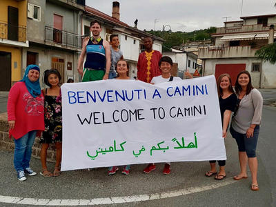 Volunteers with a banner to welcome refugees to Camini Volunteers with a banner to welcome refugees to Camini