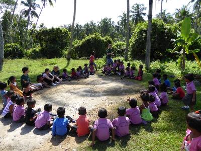 Seated children at the Care project Seated children at the Care project
