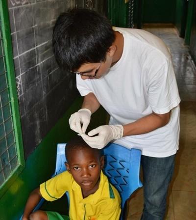 A Child Receives Treatment at an Outreach Rachel Morse