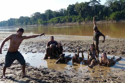 Conservation volunteers having fun near a river in the Amazon Conservation volunteers having fun near a river in the Amazon